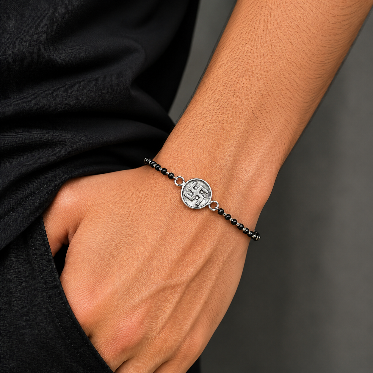 Sterling silver 8.5-inch black beaded Swastik bracelet with customized design by TRIBAL ORNAMENTS.