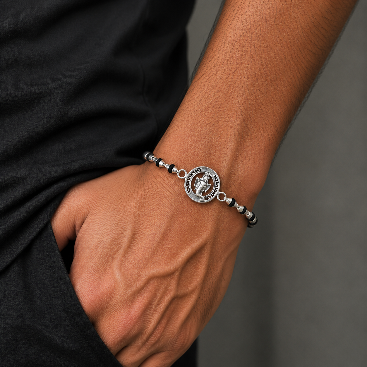 Sterling silver Lord Ganesha beaded bracelet with black Tulsi prayer beads, handmade religious jewelry by TRIBAL ORNAMENTS.