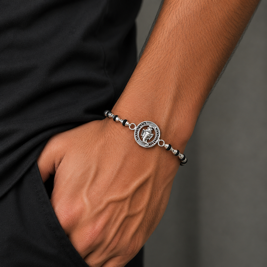 Sterling silver Lord Ganesha beaded bracelet with black Tulsi prayer beads, handmade religious jewelry by TRIBAL ORNAMENTS.