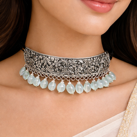 925 sterling silver Nakshi work charm necklace choker with tribal ethnic design inspired by Rajasthan cultural heritage.