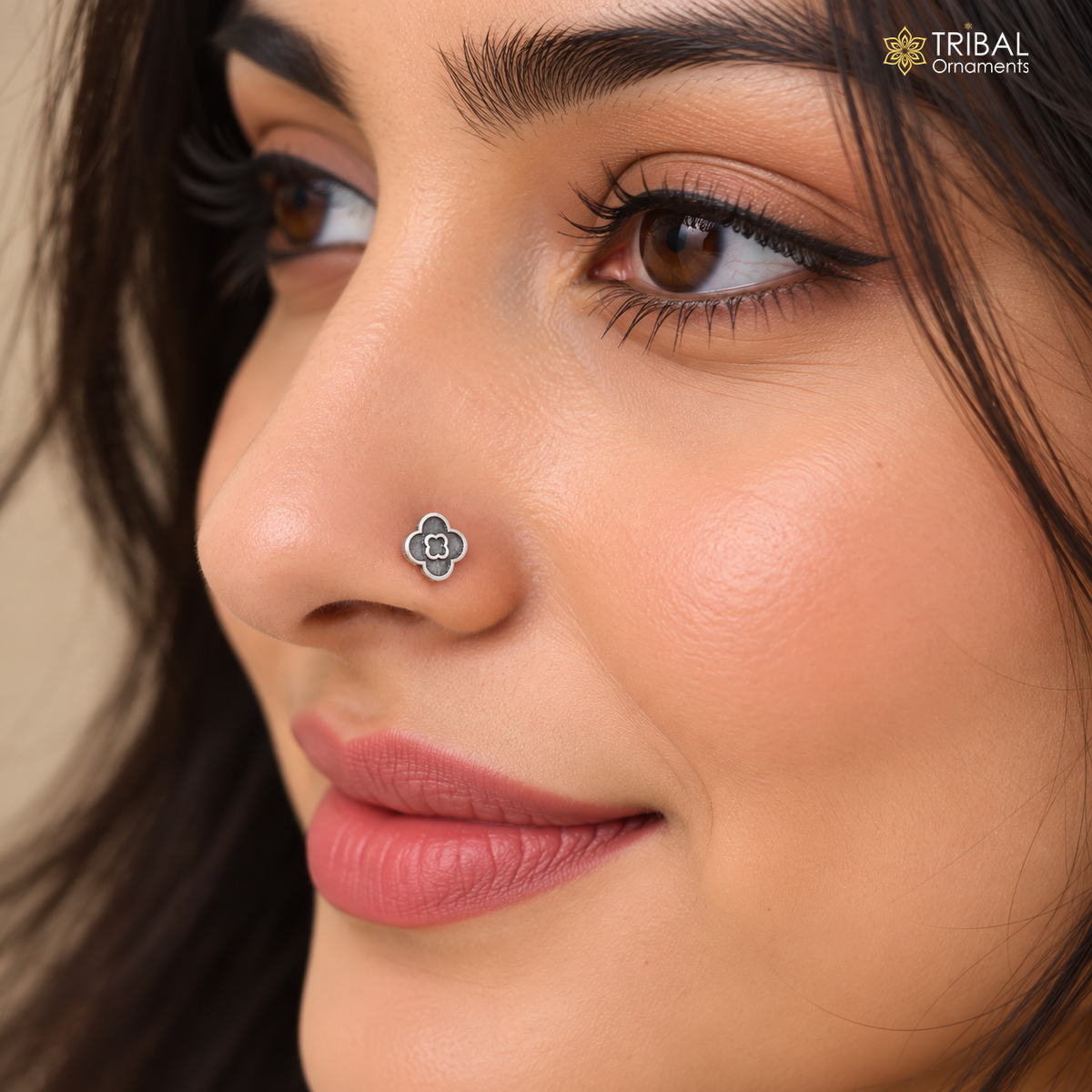 Sterling silver vintage nose pin with floral design, tribal and ethnic jewelry style, featuring intricate detailing.