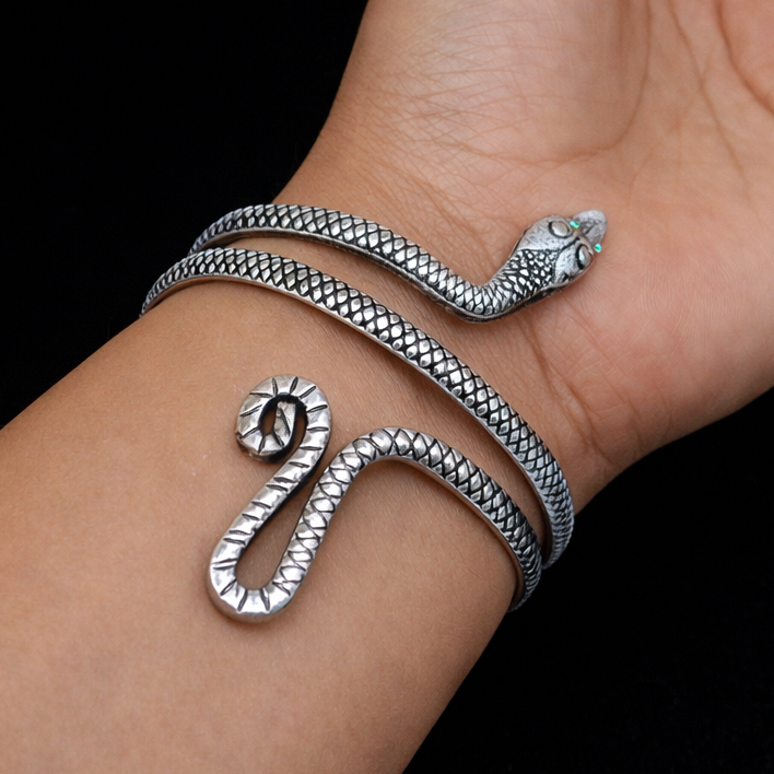 Sterling silver snake design cuff bracelet by TRIBAL ORNAMENTS, featuring a unique, handmade bracelet with intricate snake motifs.