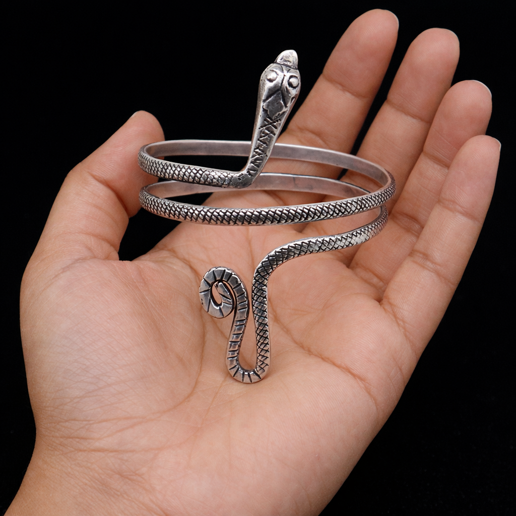 Sterling silver handmade snake design armlet by TRIBAL ORNAMENTS, featuring a cuff bangle style, suitable as arm or ankle jewelry.
