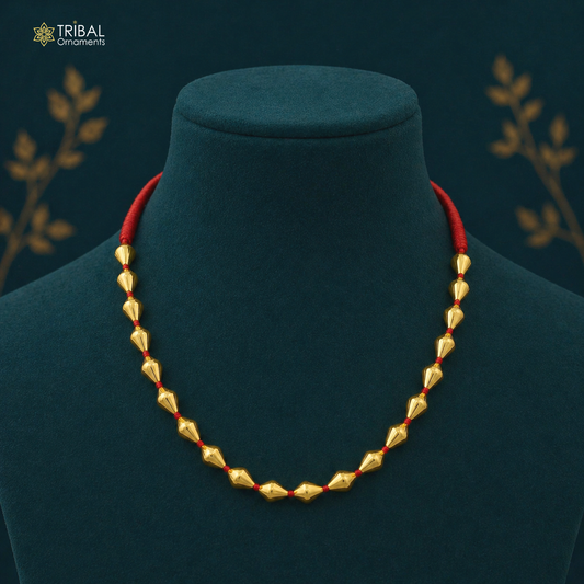Sterling silver gold-polished dholki beaded necklace with tribal design, part of Tribal Ornaments' jewelry set showcasing traditional craftsmanship.
