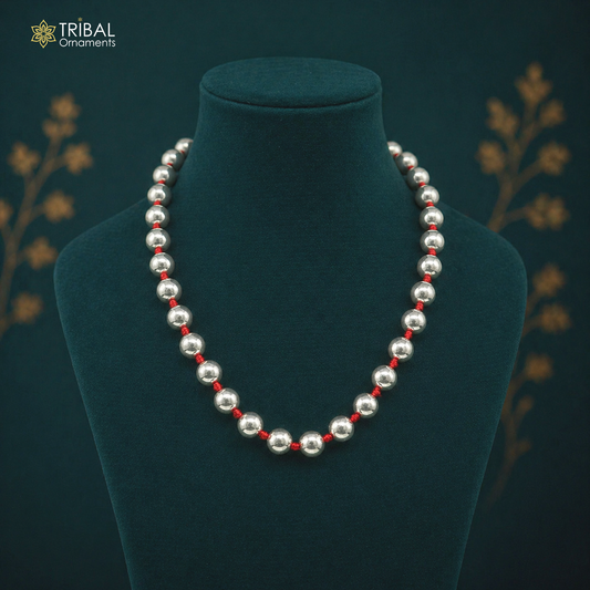 Sterling silver beaded necklace with round beads, vintage style tribal jewelry, suitable for wedding or ethnic occasions.
