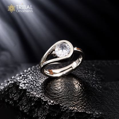 Sterling silver single stone ring with stylish design by TRIBAL ORNAMENTS, showcasing a polished silver band and a central gemstone.