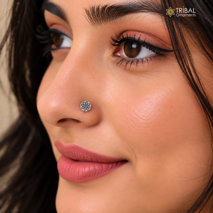 Sterling silver vintage flower-style nose pin with intricate tribal design, showcasing delicate craftsmanship for ethnic jewelry wear.