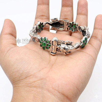 Sterling silver Ganesha bangle bracelet with floral design and green stone accents, traditional ethnic jewelry by TRIBAL ORNAMENTS.