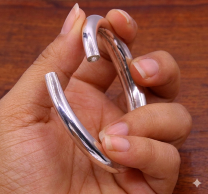 Sterling silver vintage open face bangle bracelet by TRIBAL ORNAMENTS featuring a plain handcrafted design, adjustable for unisex wear.