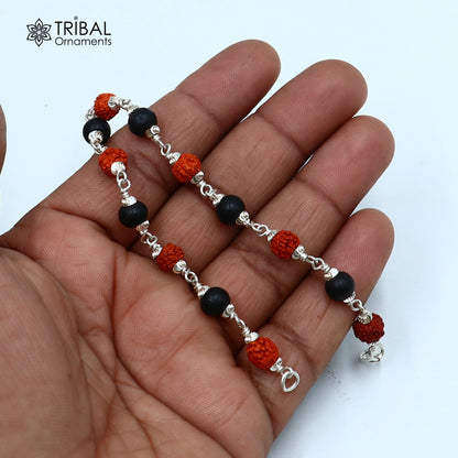 Sterling silver bracelet with black Karungali beads and Rudraksha beads, unisex tribal jewelry design.