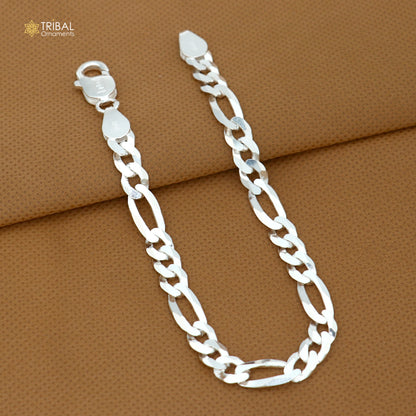 Vintage sterling silver Figaro link chain bracelet by TRIBAL ORNAMENTS, unisex jewelry with solid 925 silver craftsmanship.