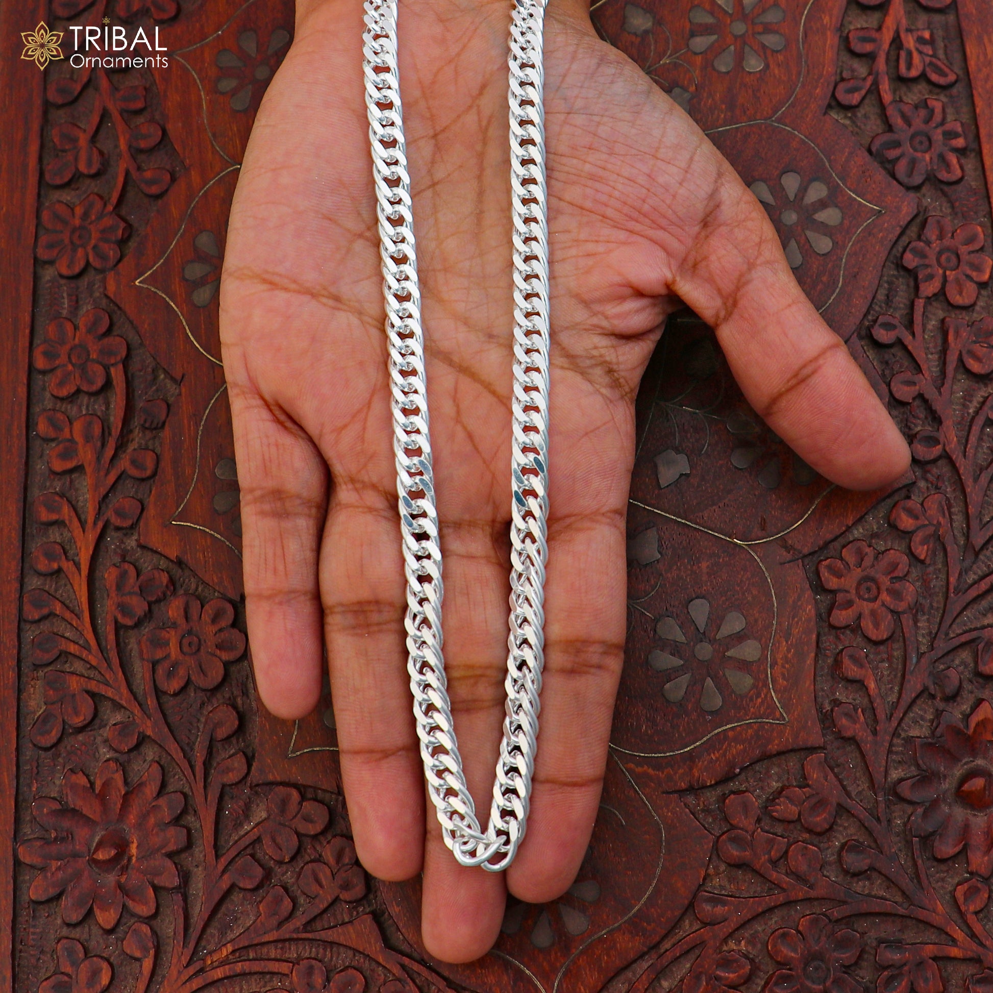 Unisex 925 sterling silver Cuban link chain jewelry by TRIBAL ORNAMENTS, close-up of the polished chain links.