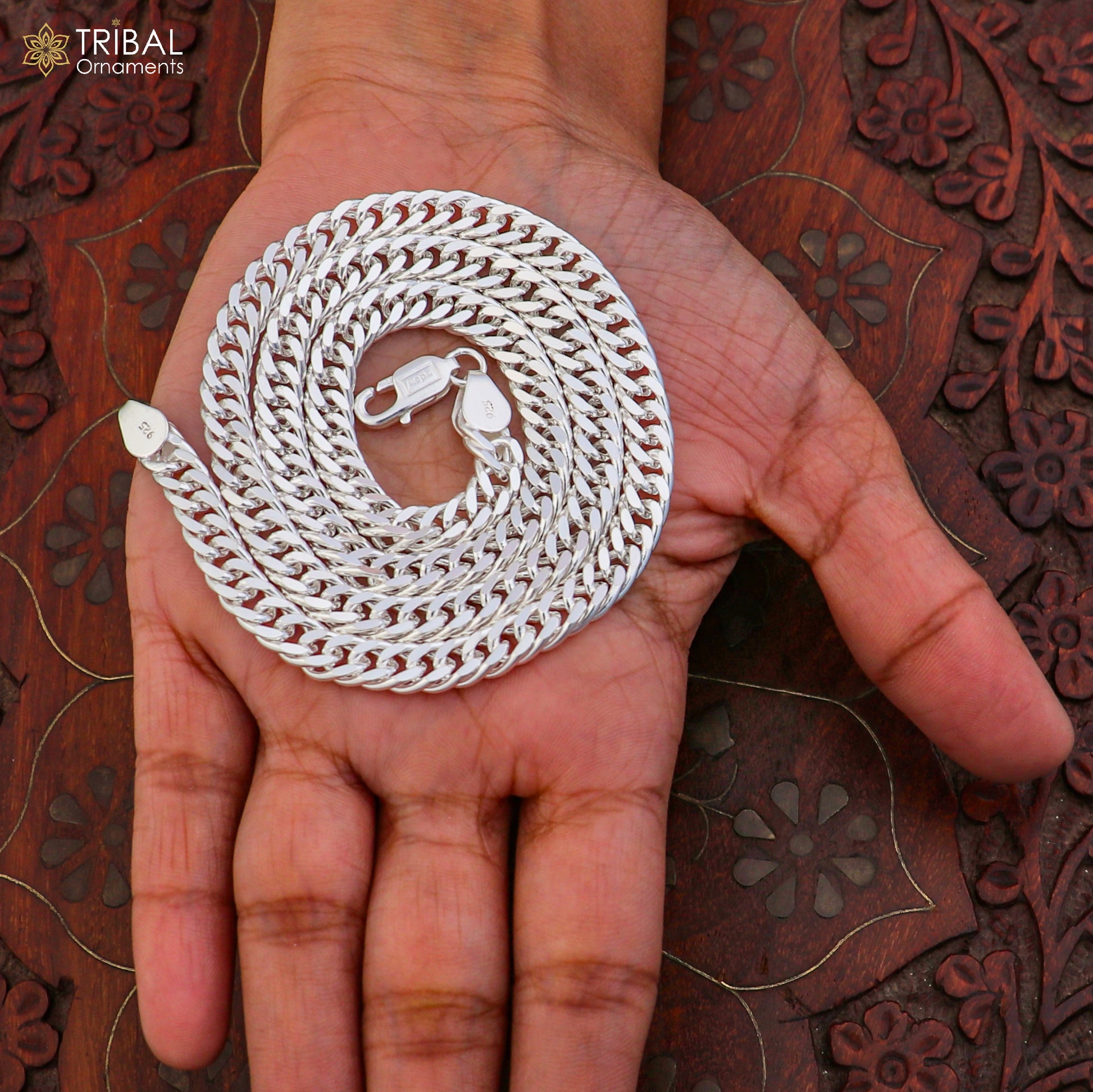 925 sterling silver Cuban link chain for unisex jewelry by TRIBAL ORNAMENTS, showing a close-up of the sleek, shiny chain.