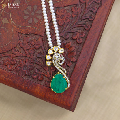 925 sterling silver Kundan work Polki charm pendant with pearl necklace jewelry set by TRIBAL ORNAMENTS, featuring intricate traditional design.