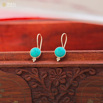 Sterling silver turquoise drop dangle earrings with round shape stones from TRIBAL ORNAMENTS, showcasing intricate jewelry design.