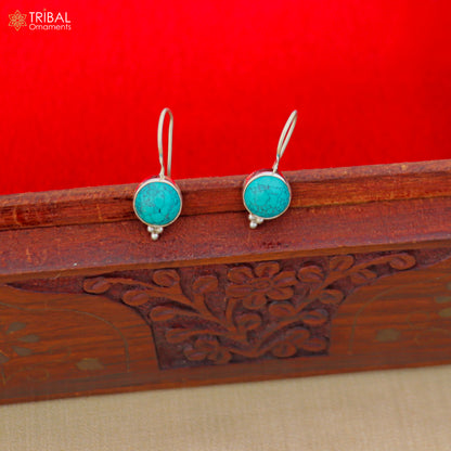 Sterling silver drop earrings with round turquoise stones and dangle design, crafted by TRIBAL ORNAMENTS.