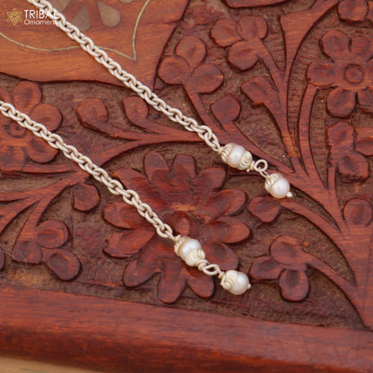 Sterling silver pearl drop earrings by TRIBAL ORNAMENTS featuring elegant dangle design and lustrous pearl accents.