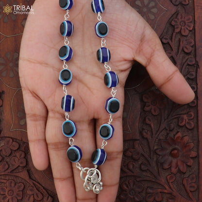 Sterling silver evil eye ankle bracelet from TRIBAL ORNAMENTS, 10.5-inch foot jewelry with stylish evil eye charm for ankle adornment.