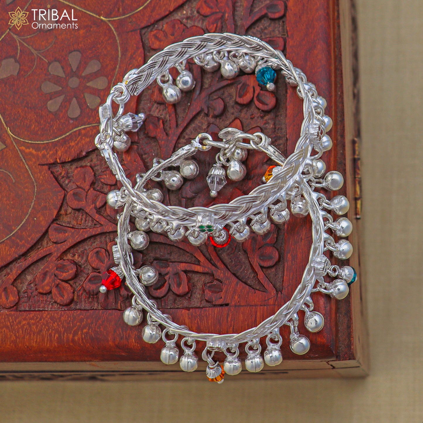 Sterling silver baby anklet by TRIBAL ORNAMENTS with customizable design, featuring jingling bells on a delicate ankle bracelet for kids.