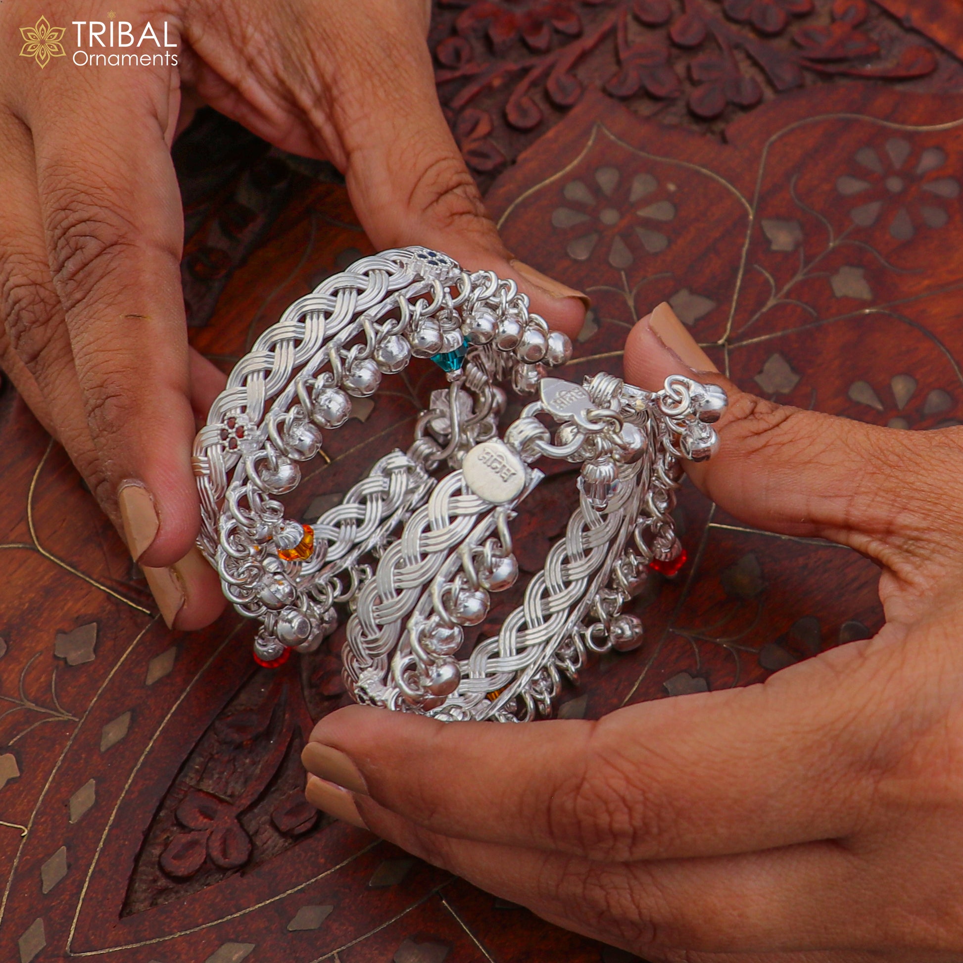 Sterling silver baby anklet with personalized design by TRIBAL ORNAMENTS, featuring jingling charms and adjustable chain for kids.