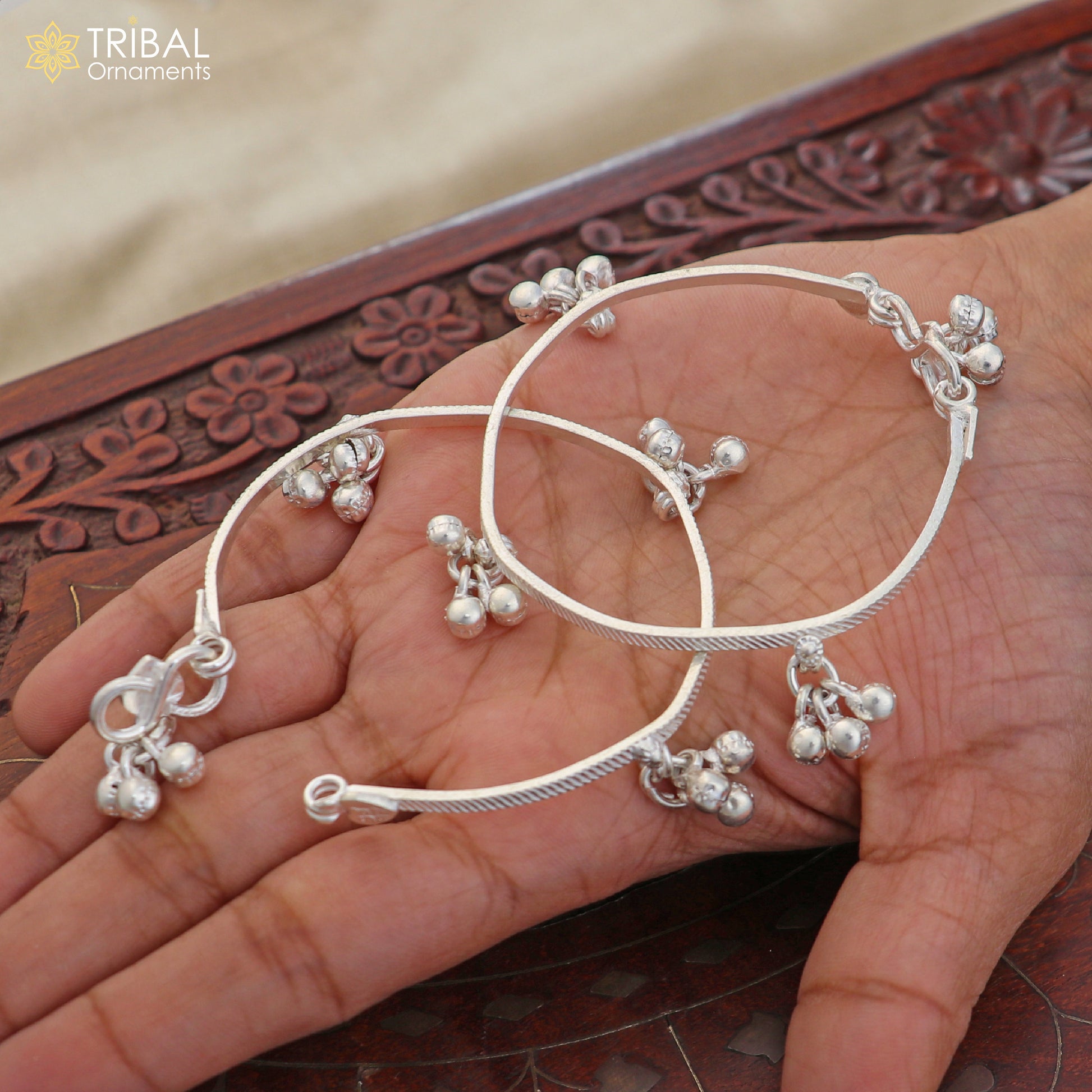 925 Sterling silver customized baby anklet with jingling charms, featuring delicate design and adjustable fit from TRIBAL ORNAMENTS.