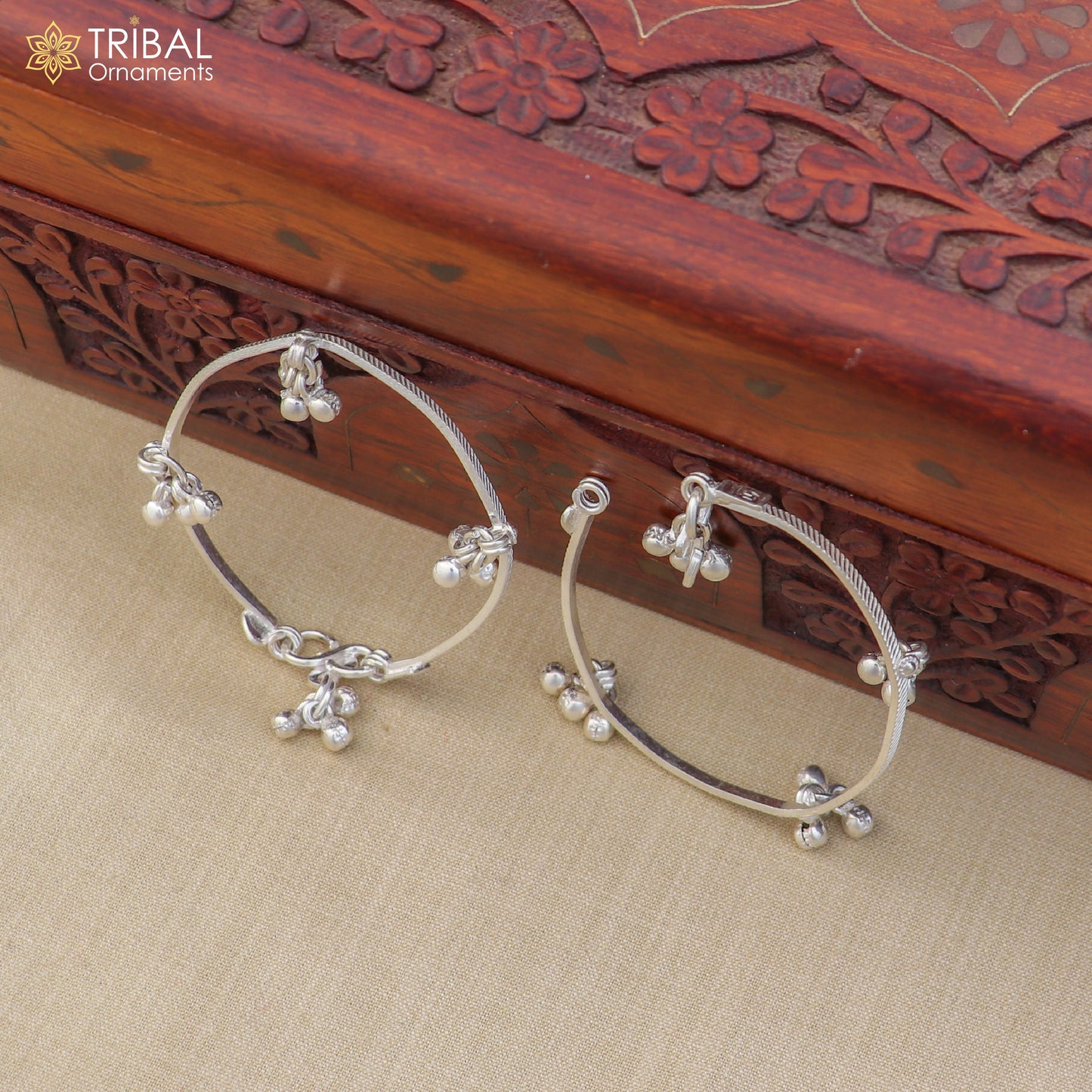 Sterling silver customized baby anklet with jingle bells, delicate design, perfect for kids' jewelry from TRIBAL ORNAMENTS.