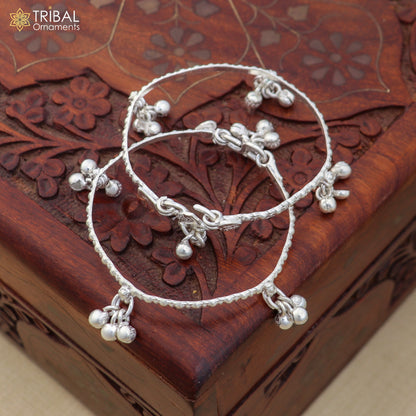 Sterling silver baby anklet with personalized charms, shiny finish, and jingling bells from TRIBAL ORNAMENTS.