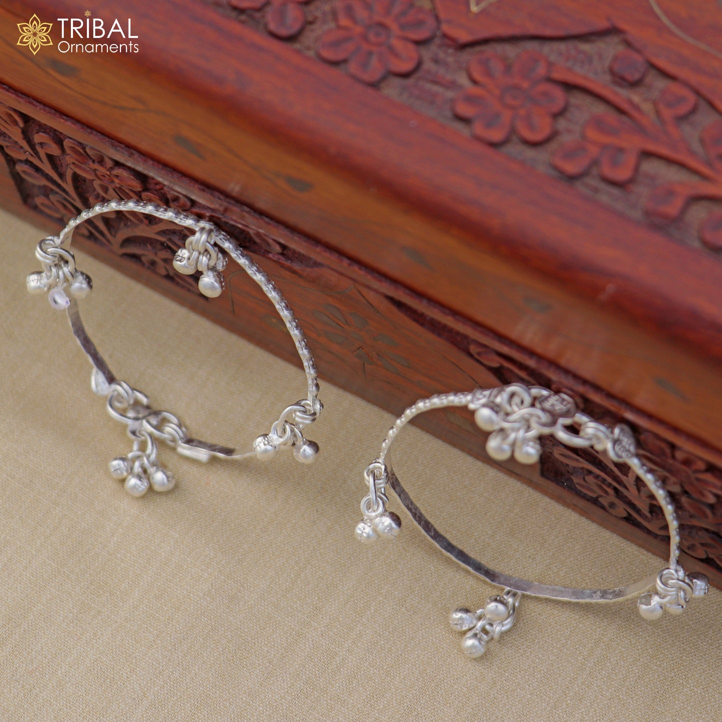 Sterling silver customized baby anklet with jingling charms, featuring delicate design perfect for kids' jewelry.