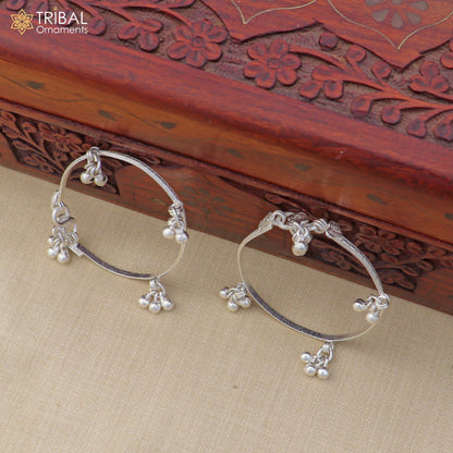 Sterling silver customized baby anklet with jingling charms, delicate kids' ankle bracelet by TRIBAL ORNAMENTS.