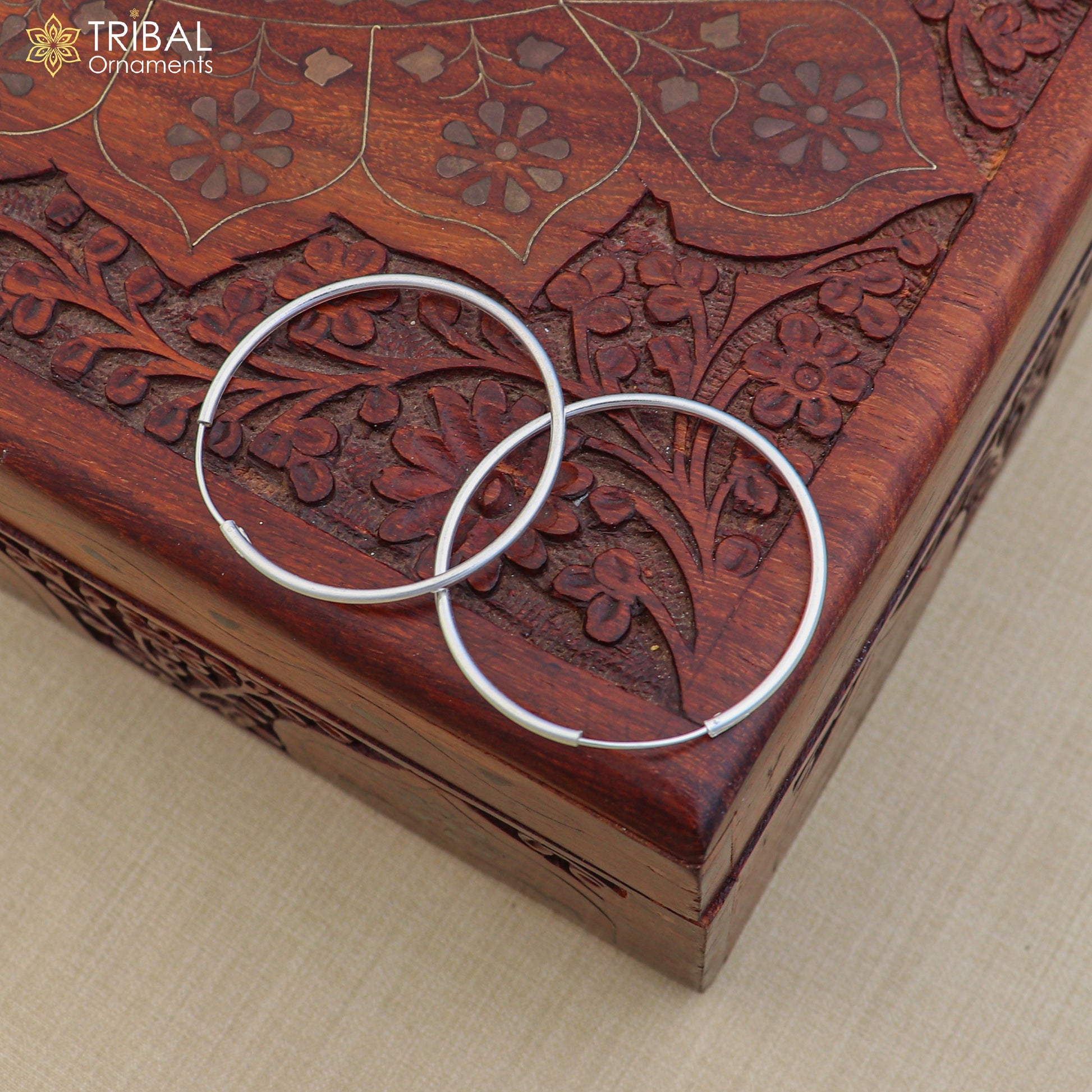 Elegant 925 sterling silver round hoops earrings from TRIBAL ORNAMENTS, showcasing smooth, polished jewelry design.