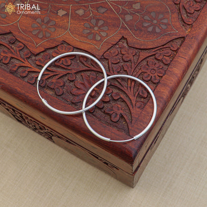 Sterling silver round hoops earrings by TRIBAL ORNAMENTS, elegant jewelry with a polished finish and classic hoop design.