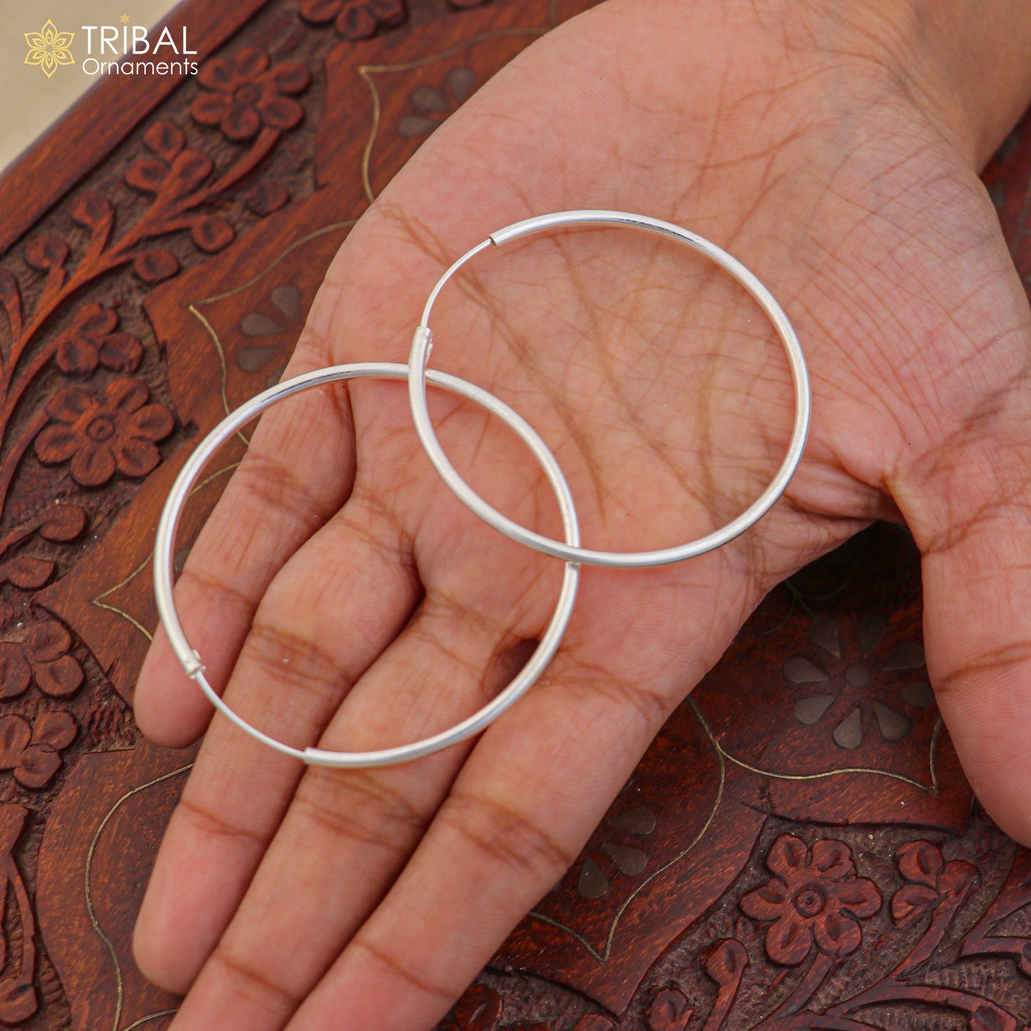 925 sterling silver round hoops earrings by TRIBAL ORNAMENTS, showcasing elegant polished jewelry with a smooth circular design.