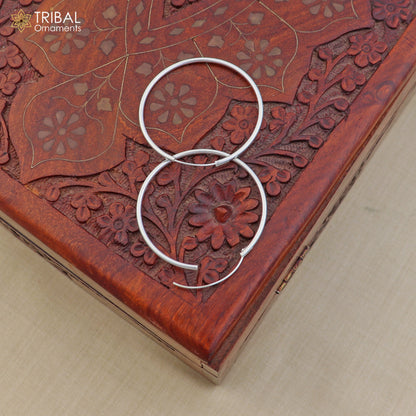 Elegant 925 sterling silver round hoops earrings by TRIBAL ORNAMENTS, showcasing polished, smooth hoop jewelry design.
