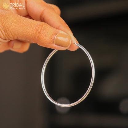 Elegant 925 sterling silver round hoops earrings by TRIBAL ORNAMENTS, showcasing smooth, polished jewelry design.
