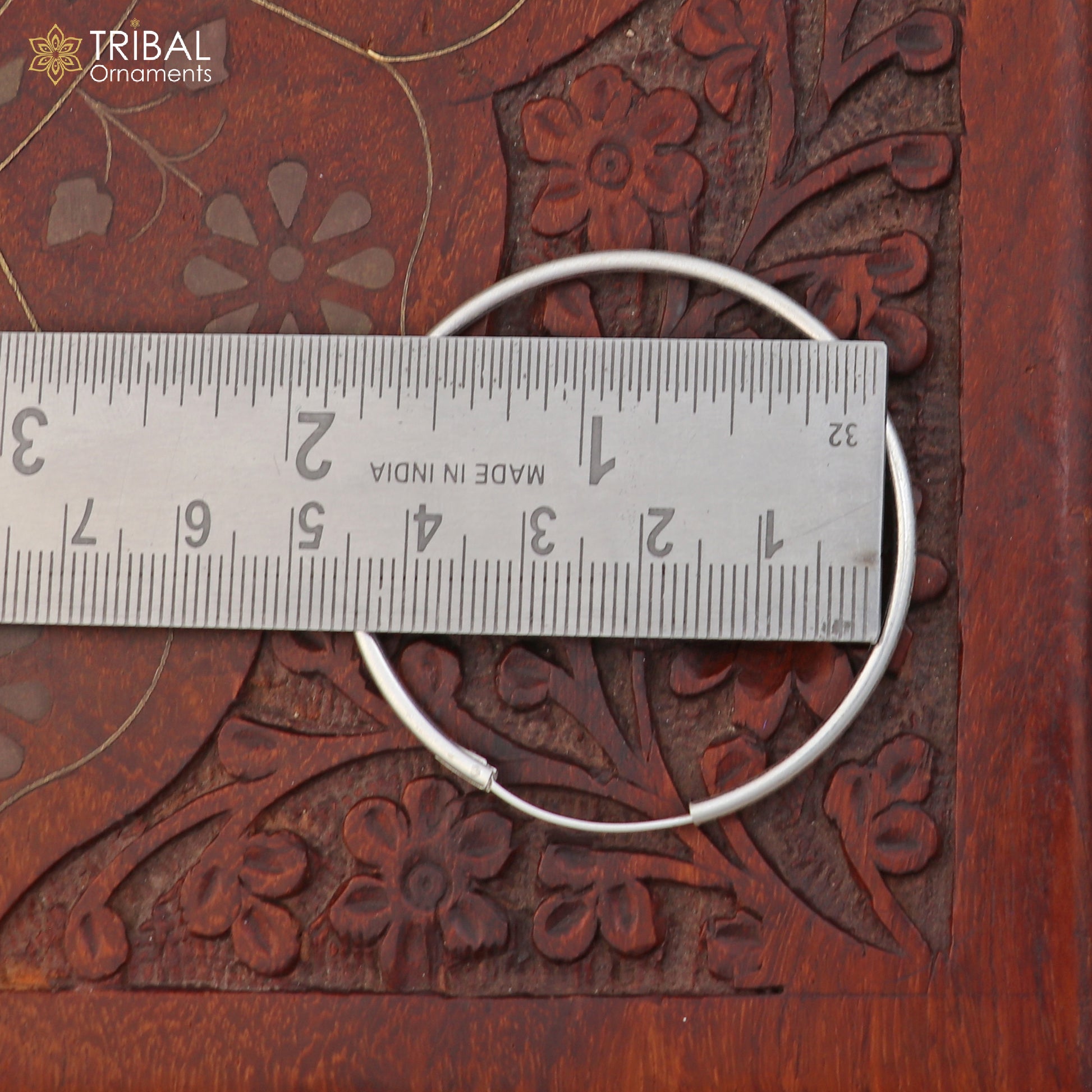 Elegant 925 sterling silver round hoops earrings by TRIBAL ORNAMENTS, showcasing smooth polished finish and classic design.