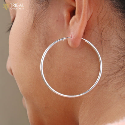 Elegant 925 sterling silver round hoops earrings from TRIBAL ORNAMENTS, showcasing smooth, polished jewelry design.