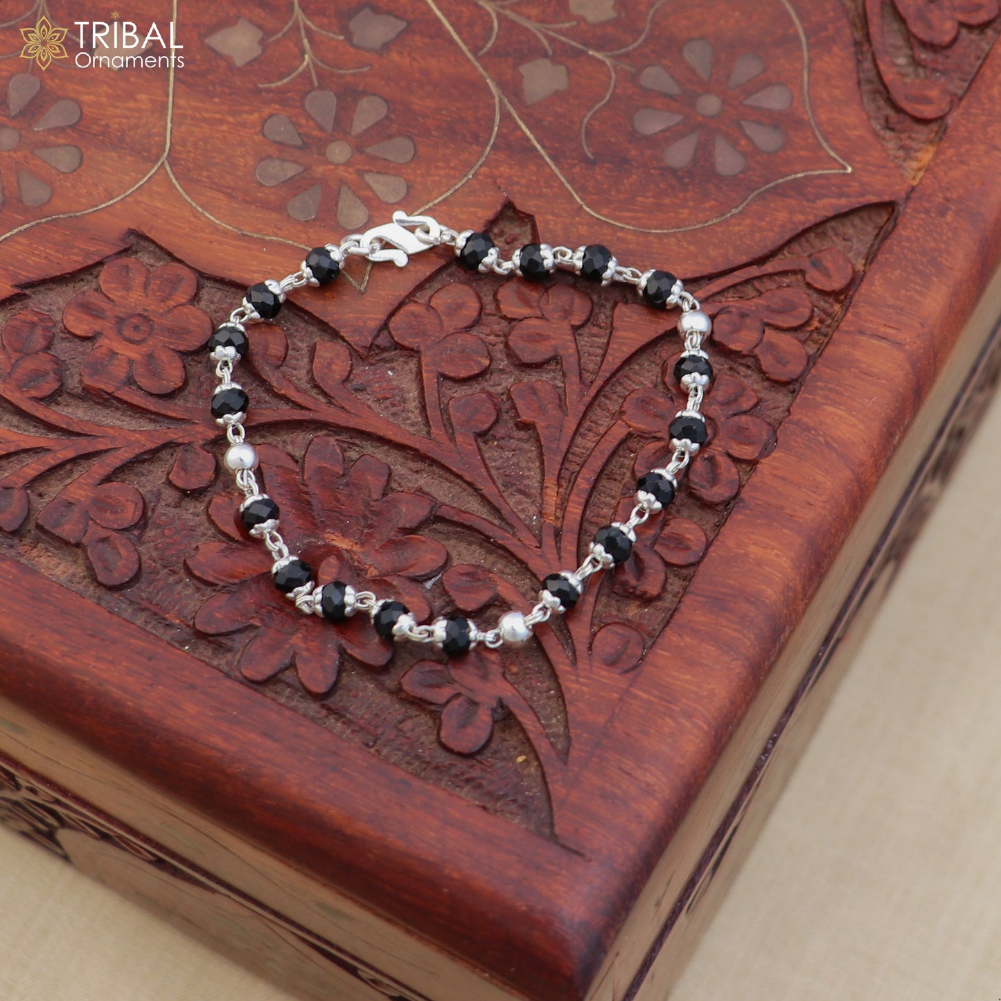 Unisex 6.5-inch sterling silver and black bead Nazariya bracelet with tribal design, featuring 925 silver accents.
