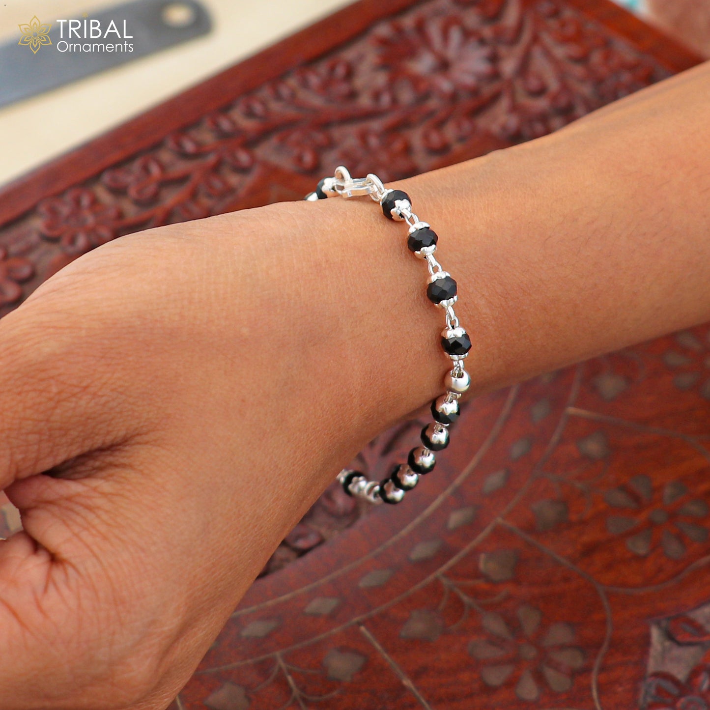 Sterling silver and black beads unisex nazariya bracelet with 6.5-inch length, featuring tribal-inspired jewelry design.