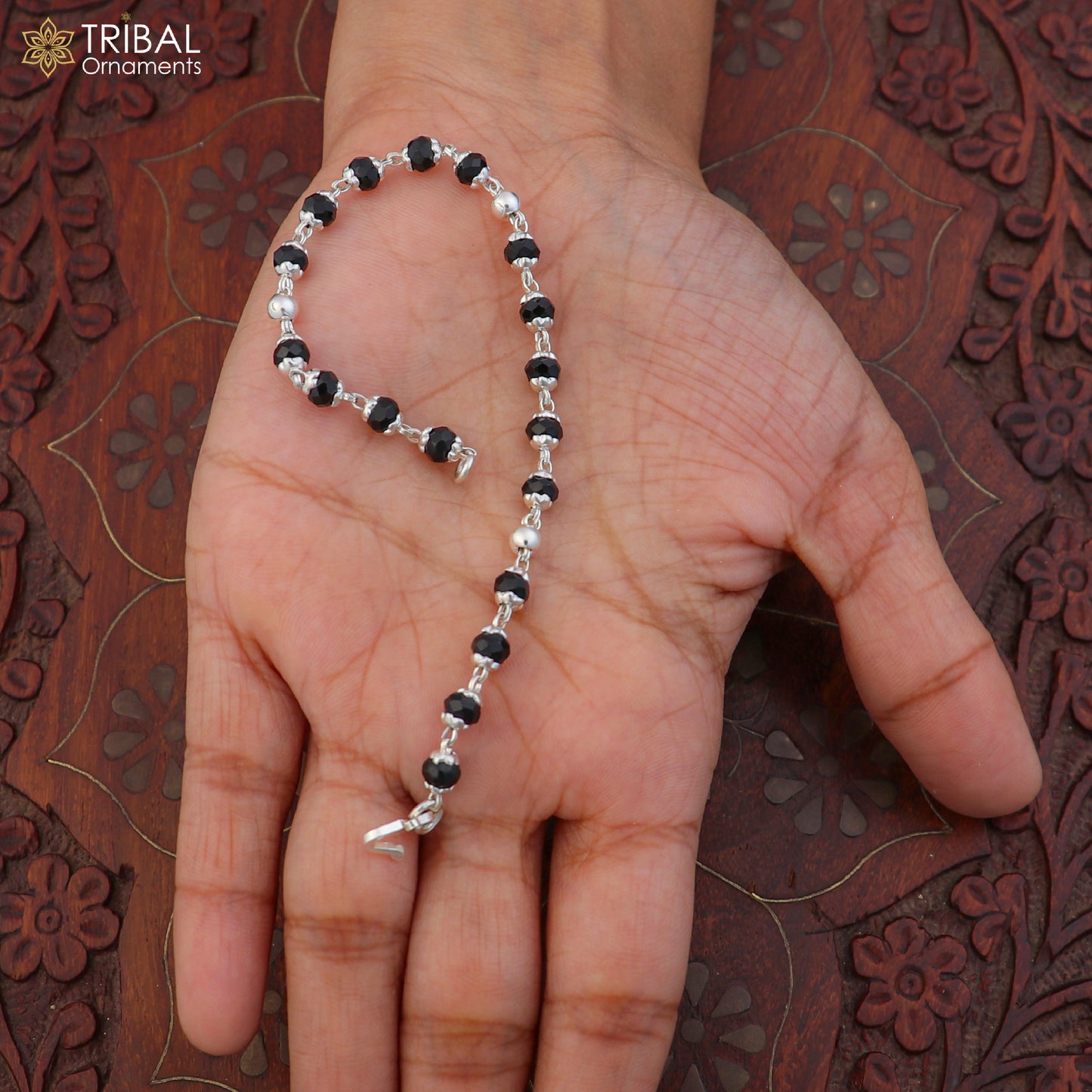Unisex 6.5-inch sterling silver and black beads Nazariya bracelet by TRIBAL ORNAMENTS, showcasing silver and black bead design.