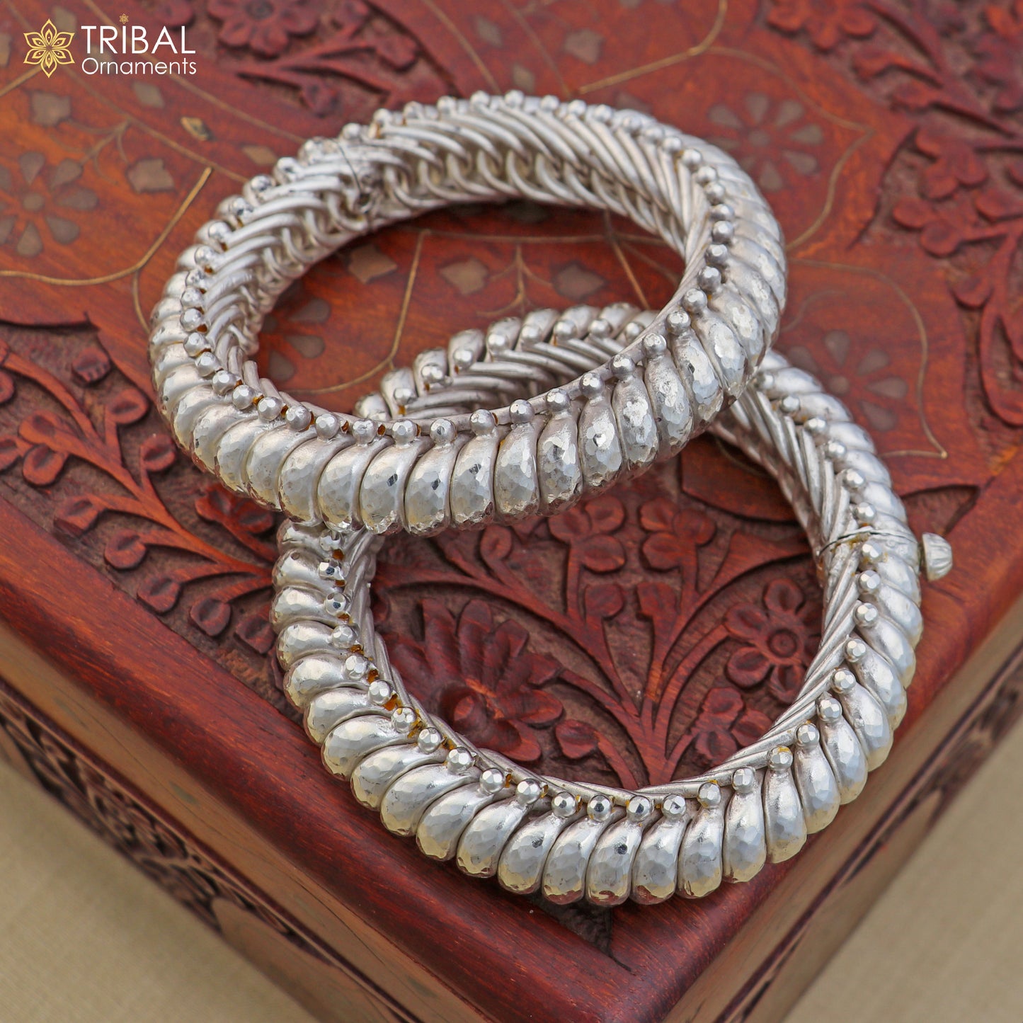 Sterling silver vintage spiral sutli design bangle by TRIBAL ORNAMENTS, showcasing intricate handcrafted jewelry with a unique pattern.