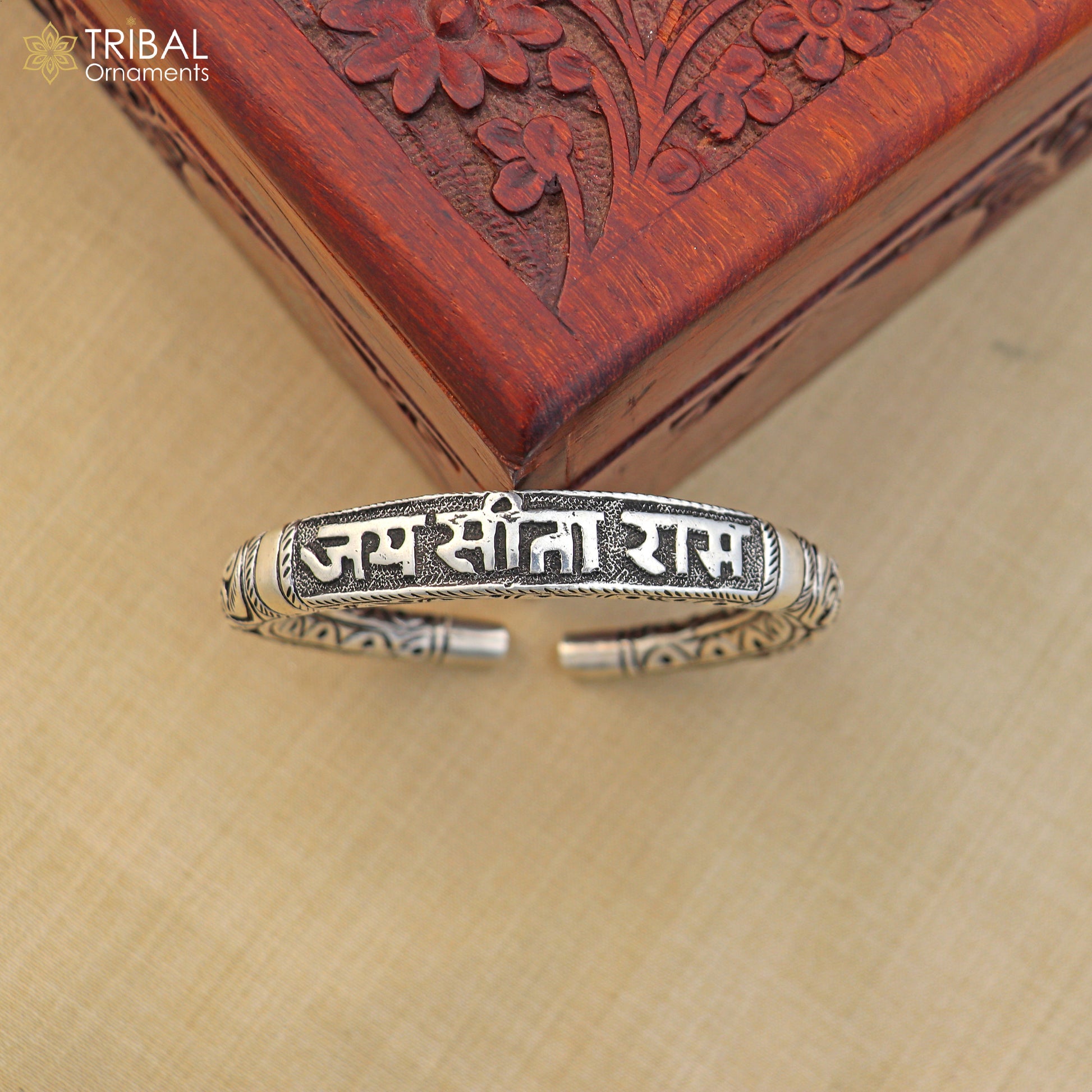 Sterling silver Ram mantra bracelet with tribal chitai work, unisex ethnic jewelry featuring "Jai Sita Ram" inscription.