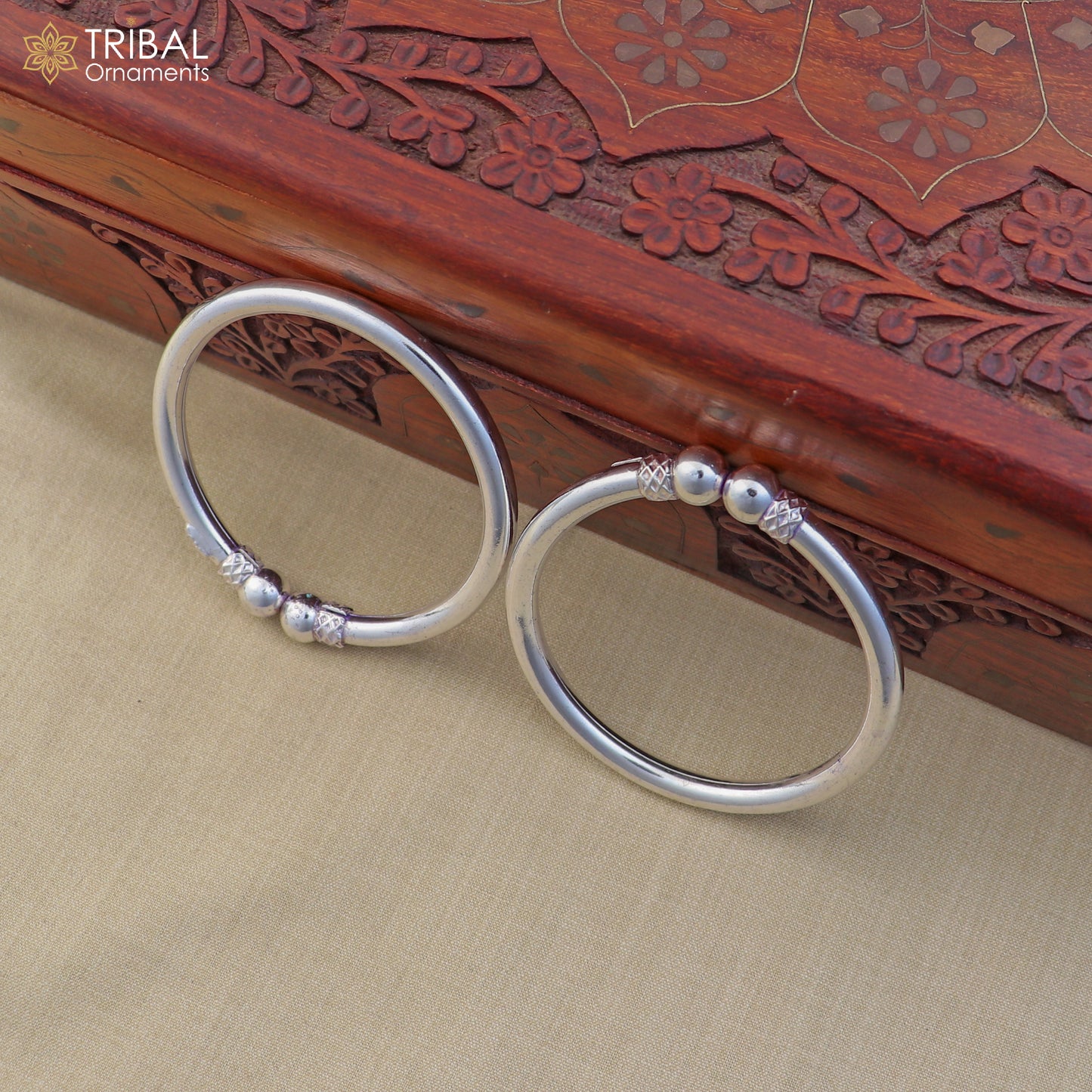 Sterling silver customized stylish ball design bangle kada with tribal jewelry details, featuring intricate craftsmanship.