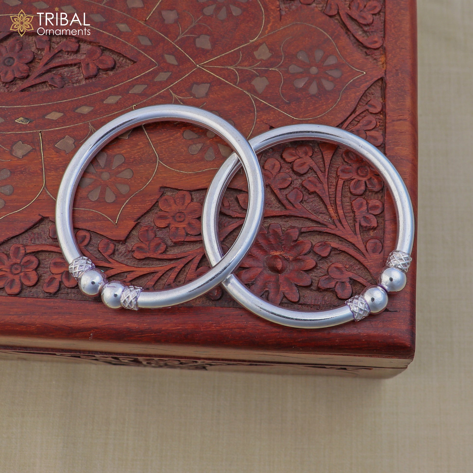 Sterling silver customized ball design bangle bracelet by TRIBAL ORNAMENTS, featuring tribal-inspired jewelry style and intricate detailing.