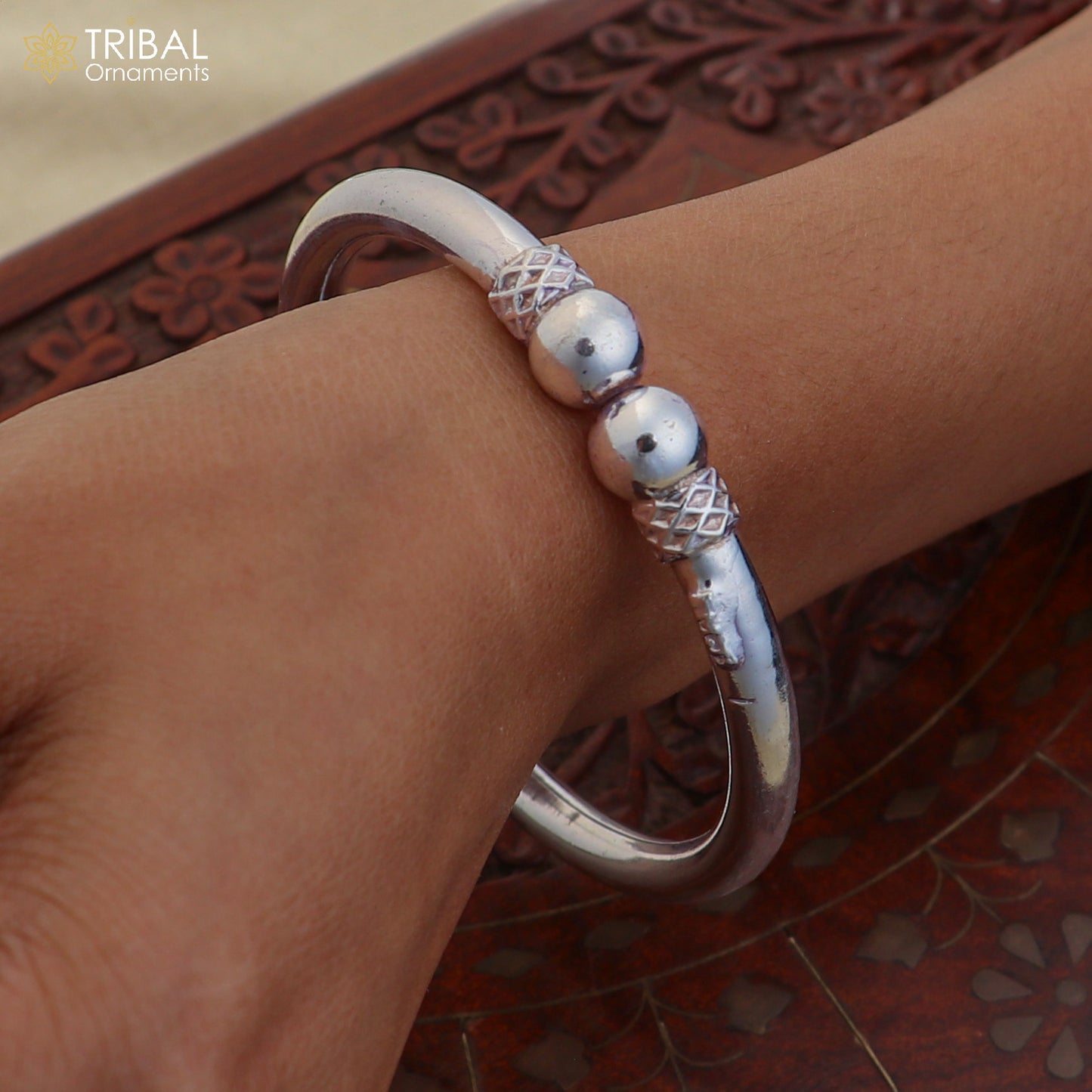 Sterling silver customized ball design bangle bracelet from TRIBAL ORNAMENTS, featuring stylish tribal jewelry with intricate details.