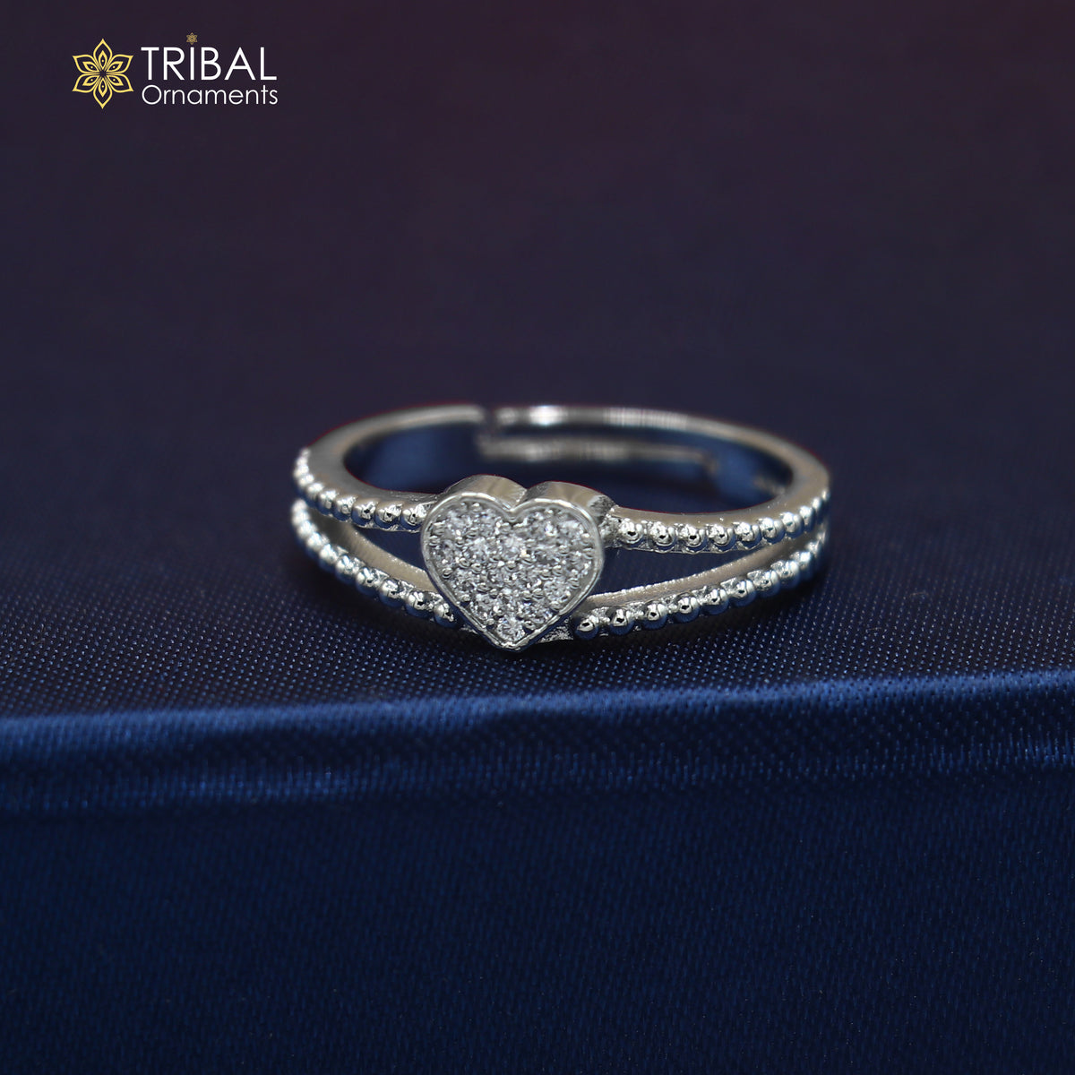 Sterling silver heart design ring with cubic zirconia stones, featuring intricate craftsmanship by TRIBAL ORNAMENTS.