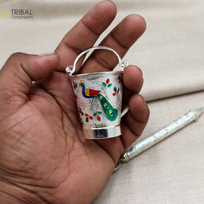 Sterling silver Pichkari and bucket accessories for Lord Krishna, crafted by TRIBAL ORNAMENTS, featuring intricate traditional design.