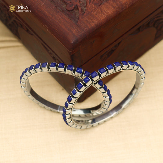 Sterling silver blue stone bangle for women, ethnic jewelry by TRIBAL ORNAMENTS, featuring intricate design and vibrant blue gemstone.