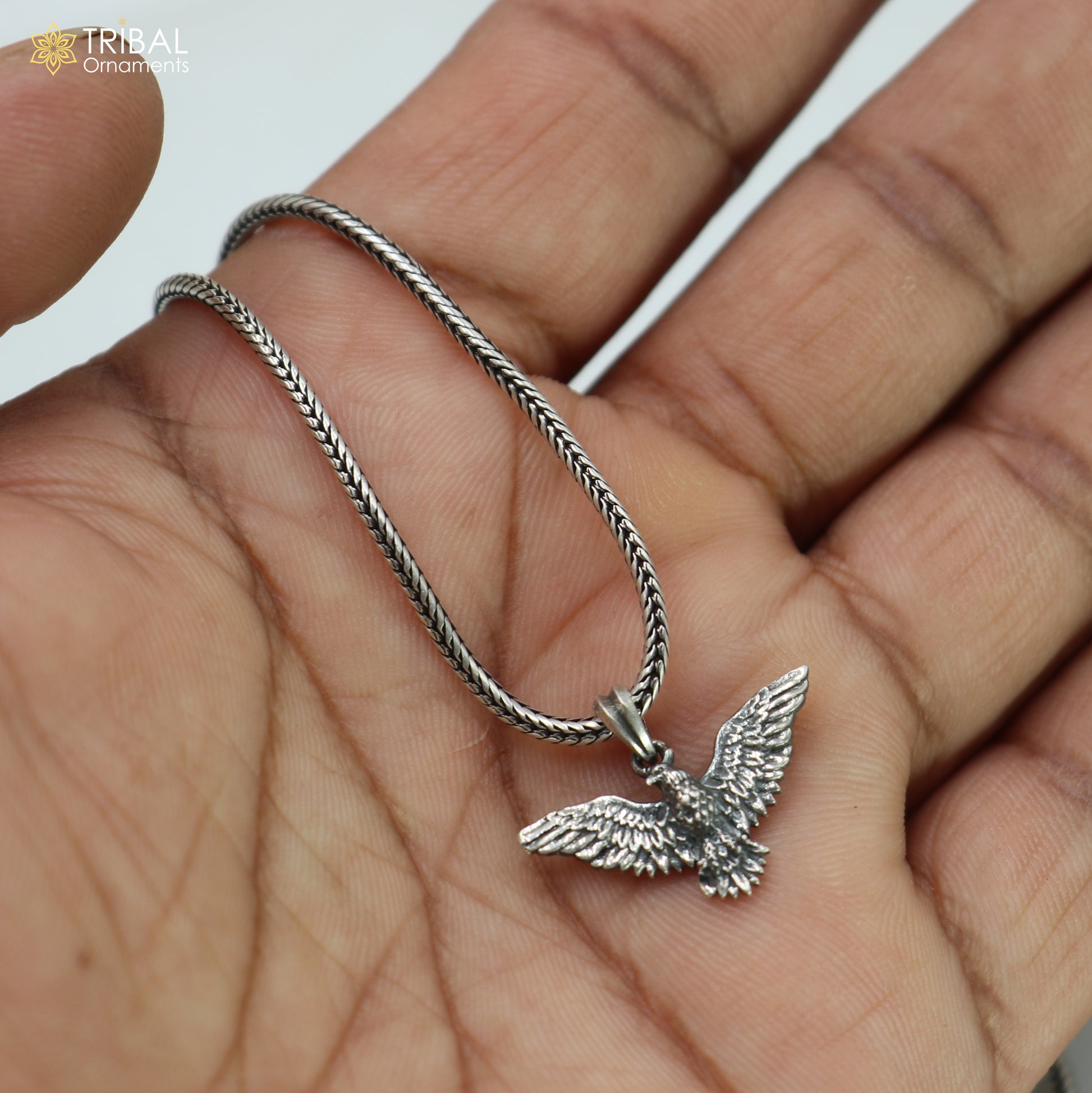 925 sterling silver eagle bird pendant with chain, tribal jewelry piece showcased against a neutral background.