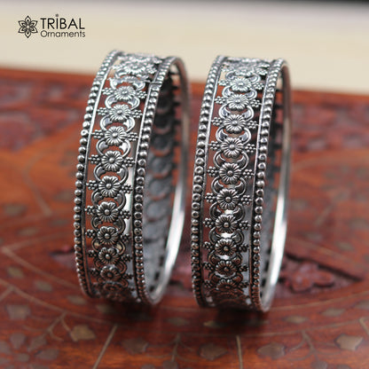 Sterling silver floral design bangle kada from TRIBAL ORNAMENTS, showcasing intricate ethnic jewelry craftsmanship.