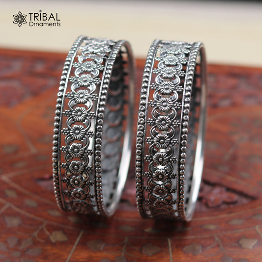 Sterling silver floral design bangle kada from TRIBAL ORNAMENTS, showcasing intricate ethnic jewelry craftsmanship.